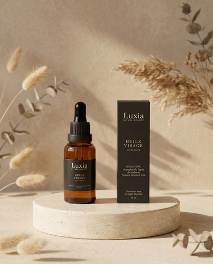 Huile visage Luxia sur pierre crème — soin naturel